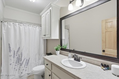 Welcome home to this charming 3-bedroom, 2-bath residence in the on Lake Caroline Golf Club in Mississippi - for sale on GolfHomes.com, golf home, golf lot