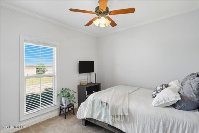 Welcome home to this charming 3-bedroom, 2-bath residence in the on Lake Caroline Golf Club in Mississippi - for sale on GolfHomes.com, golf home, golf lot