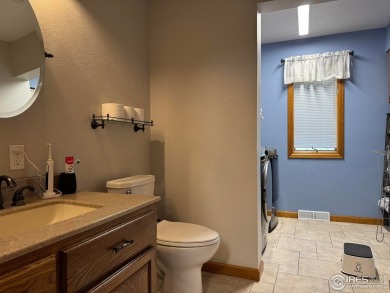 Surrounded by 40 trees, and nestled in a spacious, desirable on Pawnee Pines Golf Club in Colorado - for sale on GolfHomes.com, golf home, golf lot