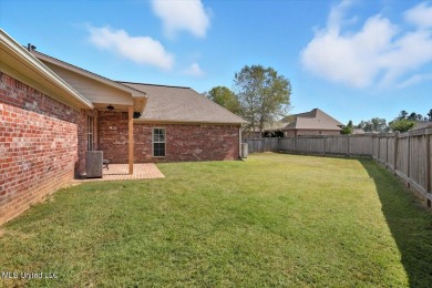 Welcome home to this charming 3-bedroom, 2-bath residence in the on Lake Caroline Golf Club in Mississippi - for sale on GolfHomes.com, golf home, golf lot