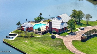 Welcome home to this charming 3-bedroom, 2-bath residence in the on Lake Caroline Golf Club in Mississippi - for sale on GolfHomes.com, golf home, golf lot