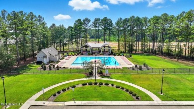 Welcome home to this charming 3-bedroom, 2-bath residence in the on Lake Caroline Golf Club in Mississippi - for sale on GolfHomes.com, golf home, golf lot