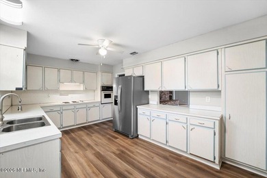 Single Level Living and no HOA in this brick, single family pool on Blue Cypress Golf Club in Florida - for sale on GolfHomes.com, golf home, golf lot