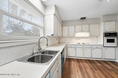 Single Level Living and no HOA in this brick, single family pool on Blue Cypress Golf Club in Florida - for sale on GolfHomes.com, golf home, golf lot