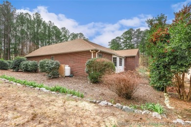 Charming all-brick home located in the gated and golf community on Carolina Trace Country Club in North Carolina - for sale on GolfHomes.com, golf home, golf lot