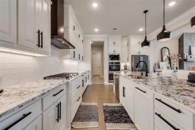 Welcome to this stunning custom-built single-story home on The Golf Club at Resort Eagle Mountain Lake in Texas - for sale on GolfHomes.com, golf home, golf lot