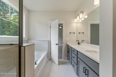 Welcome to your ideal golf and coastal retreat! This beautiful 2 on Brunswick Plantation and Golf Resorts in North Carolina - for sale on GolfHomes.com, golf home, golf lot