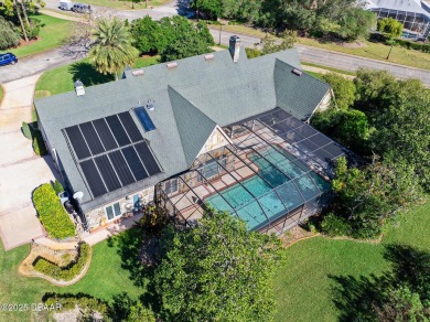 Nestled on a beautifully landscaped 0.65-acre lot, this on Plantation Bay Golf and Country Club in Florida - for sale on GolfHomes.com, golf home, golf lot