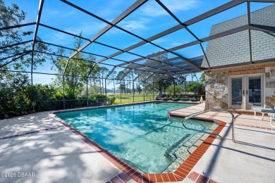 Nestled on a beautifully landscaped 0.65-acre lot, this on Plantation Bay Golf and Country Club in Florida - for sale on GolfHomes.com, golf home, golf lot