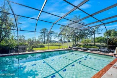 Nestled on a beautifully landscaped 0.65-acre lot, this on Plantation Bay Golf and Country Club in Florida - for sale on GolfHomes.com, golf home, golf lot