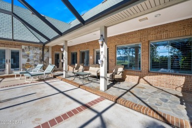 Nestled on a beautifully landscaped 0.65-acre lot, this on Plantation Bay Golf and Country Club in Florida - for sale on GolfHomes.com, golf home, golf lot