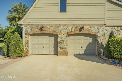 Nestled on a beautifully landscaped 0.65-acre lot, this on Plantation Bay Golf and Country Club in Florida - for sale on GolfHomes.com, golf home, golf lot