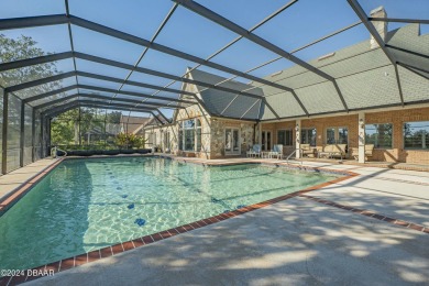 Nestled on a beautifully landscaped 0.65-acre lot, this on Plantation Bay Golf and Country Club in Florida - for sale on GolfHomes.com, golf home, golf lot