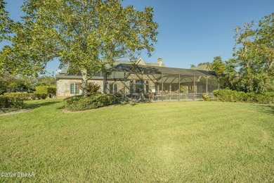 Nestled on a beautifully landscaped 0.65-acre lot, this on Plantation Bay Golf and Country Club in Florida - for sale on GolfHomes.com, golf home, golf lot