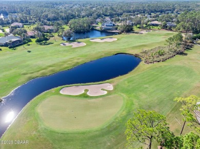 Nestled on a beautifully landscaped 0.65-acre lot, this on Plantation Bay Golf and Country Club in Florida - for sale on GolfHomes.com, golf home, golf lot