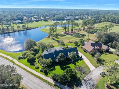 Nestled on a beautifully landscaped 0.65-acre lot, this on Plantation Bay Golf and Country Club in Florida - for sale on GolfHomes.com, golf home, golf lot