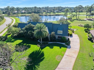 Nestled on a beautifully landscaped 0.65-acre lot, this on Plantation Bay Golf and Country Club in Florida - for sale on GolfHomes.com, golf home, golf lot