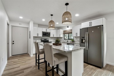 Rarely available! Remodeled Ground floor, single story end unit on IMG Academies Golf and Country Club in Florida - for sale on GolfHomes.com, golf home, golf lot