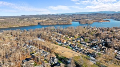 Nestled in the prestigious community of Tellico Village on a on Toqua Golf Course - Loudon County in Tennessee - for sale on GolfHomes.com, golf home, golf lot