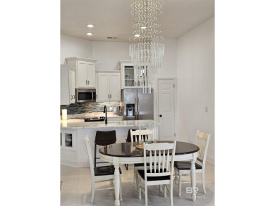 EXQUISITE TOP FLOOR LUXURY GATED CONDO IN THE HEART OF GULF on Craft Farms - Cypress Bend in Alabama - for sale on GolfHomes.com, golf home, golf lot
