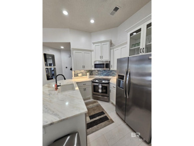 EXQUISITE TOP FLOOR LUXURY GATED CONDO IN THE HEART OF GULF on Craft Farms - Cypress Bend in Alabama - for sale on GolfHomes.com, golf home, golf lot