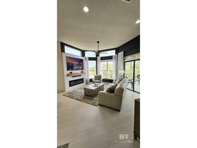 EXQUISITE TOP FLOOR LUXURY GATED CONDO IN THE HEART OF GULF on Craft Farms - Cypress Bend in Alabama - for sale on GolfHomes.com, golf home, golf lot