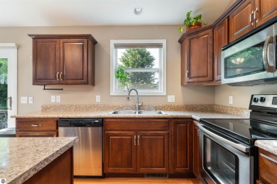 Welcome to this spacious 3-bedroom, 2-bath walkout home on on Bay Meadows Golf Course - Executive in Michigan - for sale on GolfHomes.com, golf home, golf lot