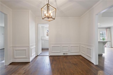 Don't miss this delightful white brick home in the heart of one on Bobby Jones Golf Club in Georgia - for sale on GolfHomes.com, golf home, golf lot
