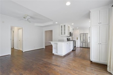 Don't miss this delightful white brick home in the heart of one on Bobby Jones Golf Club in Georgia - for sale on GolfHomes.com, golf home, golf lot