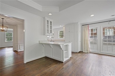 Don't miss this delightful white brick home in the heart of one on Bobby Jones Golf Club in Georgia - for sale on GolfHomes.com, golf home, golf lot