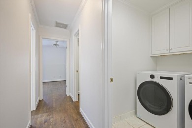 Don't miss this delightful white brick home in the heart of one on Bobby Jones Golf Club in Georgia - for sale on GolfHomes.com, golf home, golf lot