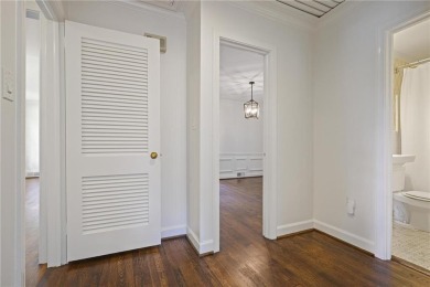 Don't miss this delightful white brick home in the heart of one on Bobby Jones Golf Club in Georgia - for sale on GolfHomes.com, golf home, golf lot