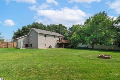 Welcome to this spacious 3-bedroom, 2-bath walkout home on on Bay Meadows Golf Course - Executive in Michigan - for sale on GolfHomes.com, golf home, golf lot