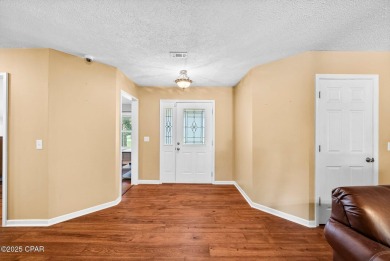 This spacious and beautifully updated 4-bedroom, 2.5-bath brick on Panama Country Club in Florida - for sale on GolfHomes.com, golf home, golf lot