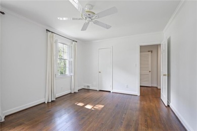 Don't miss this delightful white brick home in the heart of one on Bobby Jones Golf Club in Georgia - for sale on GolfHomes.com, golf home, golf lot
