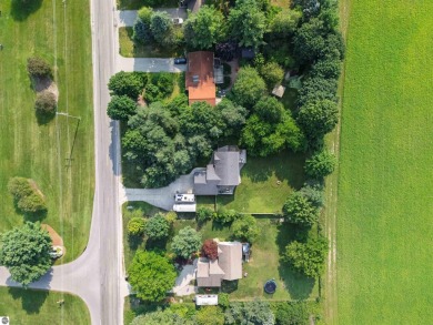 Welcome to this spacious 3-bedroom, 2-bath walkout home on on Bay Meadows Golf Course - Executive in Michigan - for sale on GolfHomes.com, golf home, golf lot