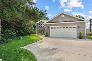 Welcome to this spacious 3-bedroom, 2-bath walkout home on on Bay Meadows Golf Course - Executive in Michigan - for sale on GolfHomes.com, golf home, golf lot