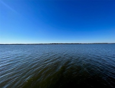 This waterfront property boasts a panoramic view of Lake Fork on Lake Fork Golf Club - Rains County in Texas - for sale on GolfHomes.com, golf home, golf lot