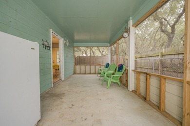 Nestled beneath large shade oak trees, this fully furnished on Rockport Country Club in Texas - for sale on GolfHomes.com, golf home, golf lot