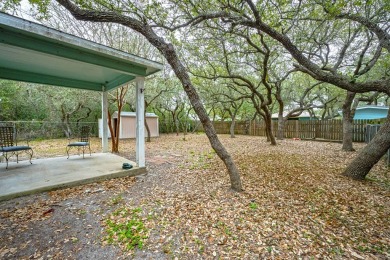 Nestled beneath large shade oak trees, this fully furnished on Rockport Country Club in Texas - for sale on GolfHomes.com, golf home, golf lot