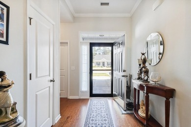 Enjoy stunning views of a serene pond from this beautifully on Palmetto Greens Golf and Country Club in South Carolina - for sale on GolfHomes.com, golf home, golf lot