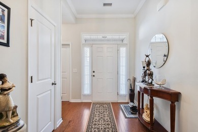 Enjoy stunning views of a serene pond from this beautifully on Palmetto Greens Golf and Country Club in South Carolina - for sale on GolfHomes.com, golf home, golf lot