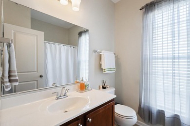 Enjoy stunning views of a serene pond from this beautifully on Palmetto Greens Golf and Country Club in South Carolina - for sale on GolfHomes.com, golf home, golf lot