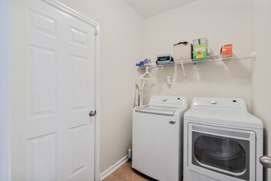 Enjoy stunning views of a serene pond from this beautifully on Palmetto Greens Golf and Country Club in South Carolina - for sale on GolfHomes.com, golf home, golf lot