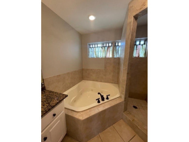Situated along the waters edge in the prestigious neighborhood on Red Eagle Golf Course in Alabama - for sale on GolfHomes.com, golf home, golf lot