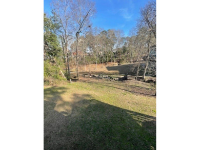 Situated along the waters edge in the prestigious neighborhood on Red Eagle Golf Course in Alabama - for sale on GolfHomes.com, golf home, golf lot