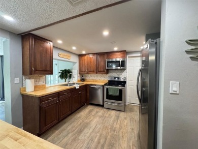 Under contract-accepting backup offers. This stunning move-in on Beacon Woods Golf Club in Florida - for sale on GolfHomes.com, golf home, golf lot
