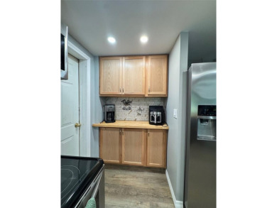 Under contract-accepting backup offers. This stunning move-in on Beacon Woods Golf Club in Florida - for sale on GolfHomes.com, golf home, golf lot