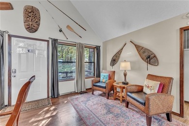 This home boasts a view like few others can perched high on a on Holiday Island Executive Golf Course in Arkansas - for sale on GolfHomes.com, golf home, golf lot