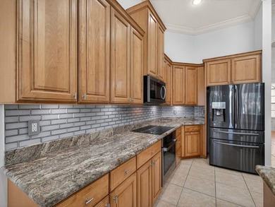 Tucked away on a rarely available, exceptionally private lot at on The Legacy Golf and Tennis Club in Florida - for sale on GolfHomes.com, golf home, golf lot